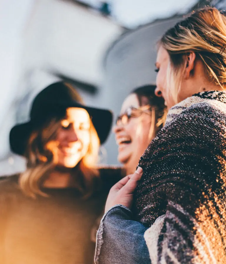 A group of women, smiling and laughing.